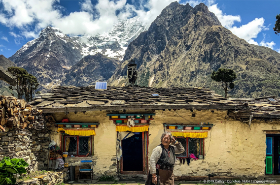 This home is attached to a small monastery in Sama, so it is more carefully constructed and more colourful. Houses are constructed from tightly piled stones but this home has been insulated by a coating of yak dung and paint. The monk’s wife stands in front.
 